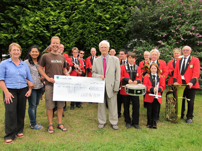 Lost In Film presenting cheque to Lostwithiel Town Band