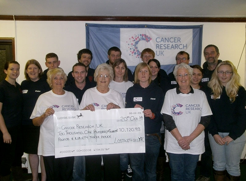 Lostwithiel YFC presenting cheque to Cancer Research