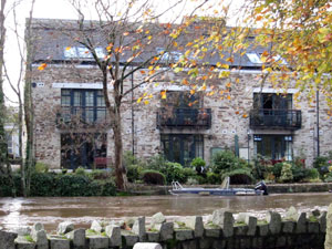 River nearly breaching banks at Brunel Quay