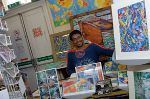 Stallholder selling prints © Keith Seume