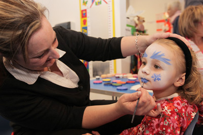 Preschool children having facepainting