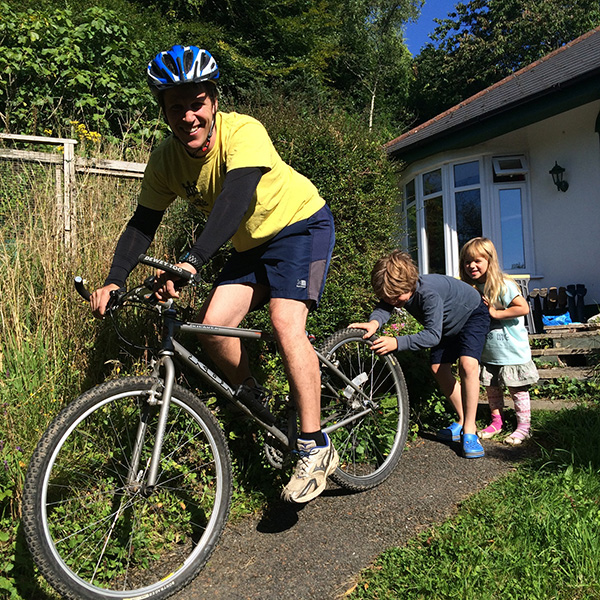 Dominic Bond with children Raffy and Lottie, ready to cycle to work as part of his general  fitness training.